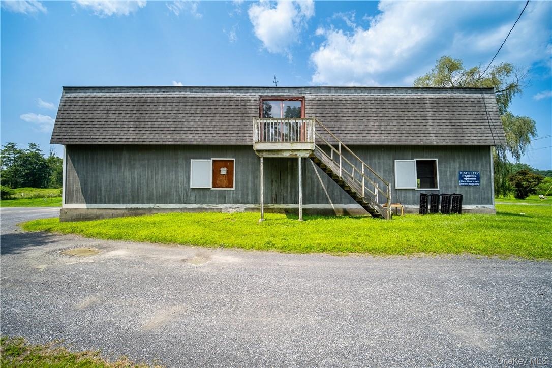 239 Springtown Road New Paltz, NY 12561 - Photo 20 of 36 a front view of a house with a yard and garage
