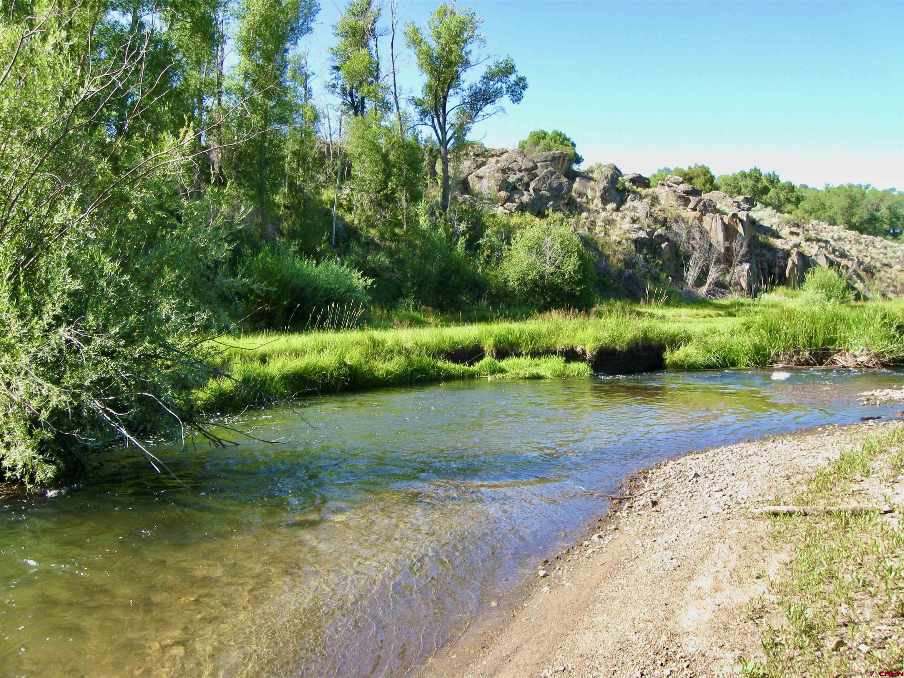 32 Bench Road Parlin, CO 81239 - Photo 23 of 34 a view of a garden with a building in the background