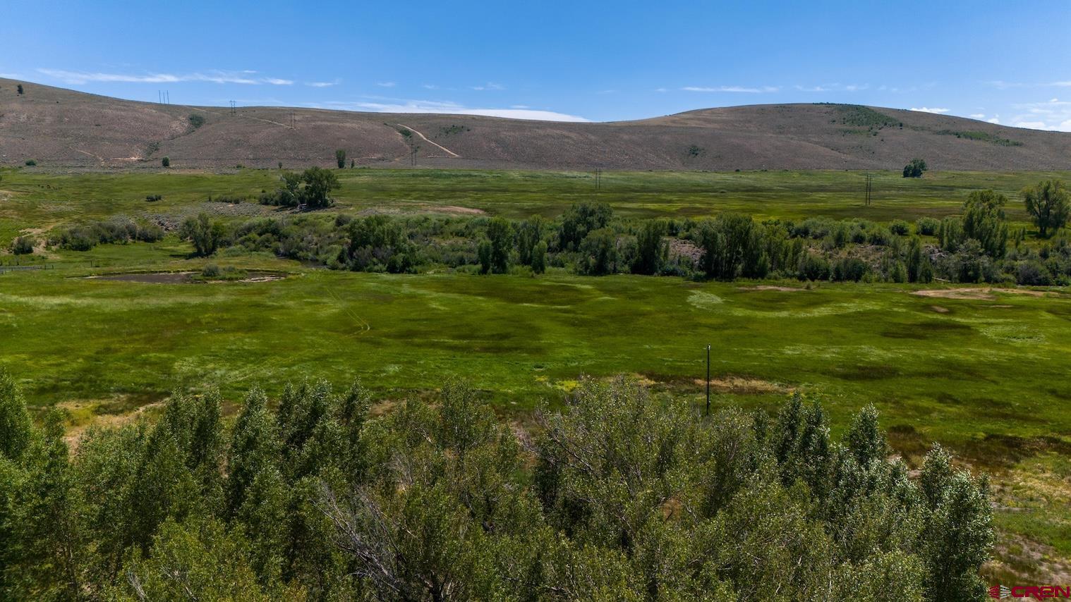 32 Bench Road Parlin, CO 81239 - Photo 5 of 34 a view of a lush green outdoor space with a lake view