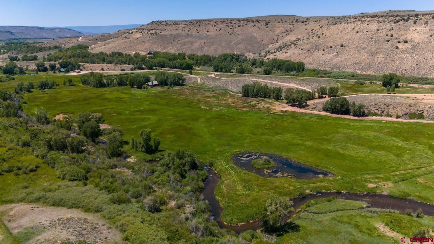 32 Bench Road Parlin, CO 81239 - Photo 7 of 34 an aerial view of huge green field with lots of green plants in it