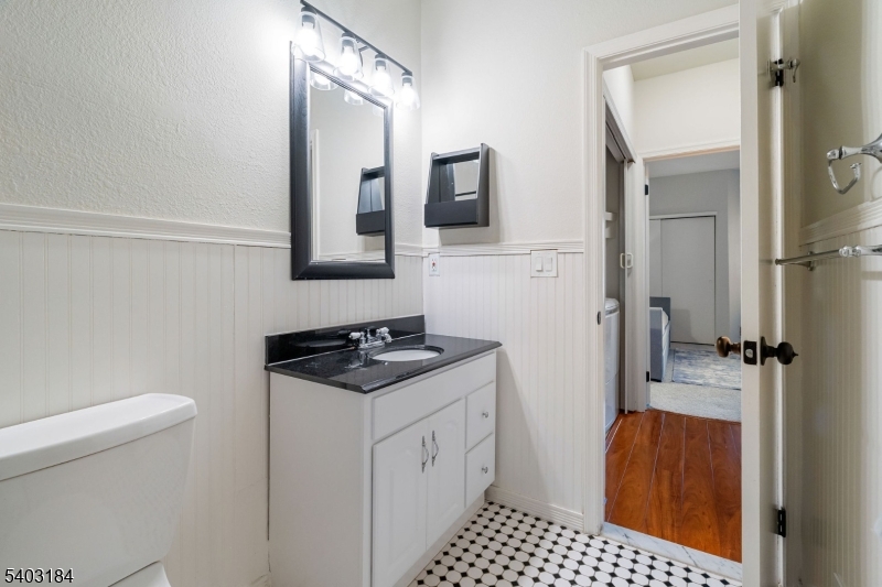 3 Wescott Road Bedminster, NJ 07921 - Photo 13 of 15 a bathroom with a sink toilet and mirror