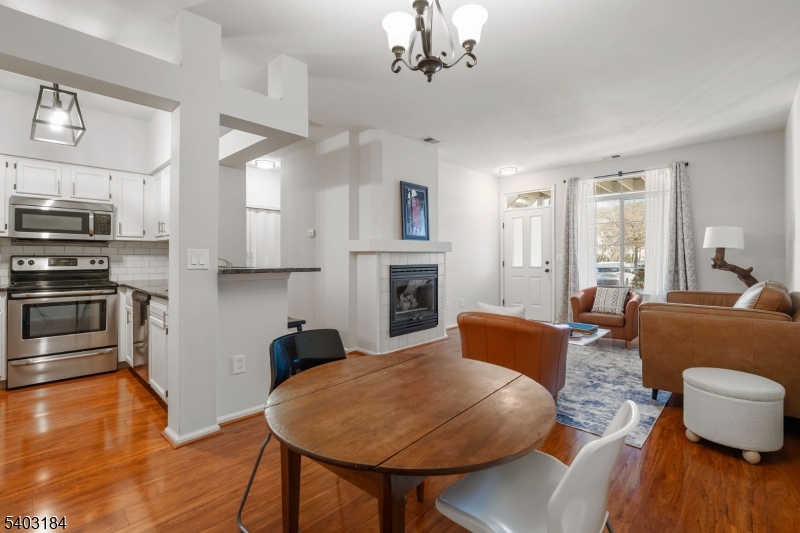 3 Wescott Road Bedminster, NJ 07921 - Photo 5 of 15 a living room with fireplace furniture and a wooden floor