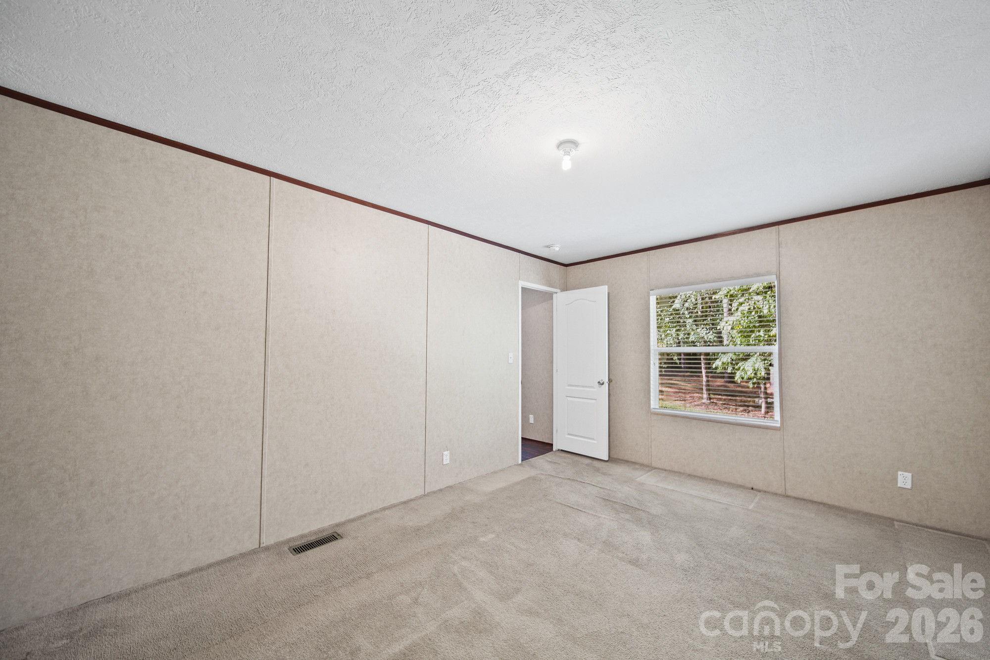 4507 White Store Road Wingate, NC 28174 - Photo 17 of 29 a view of an empty room with a window