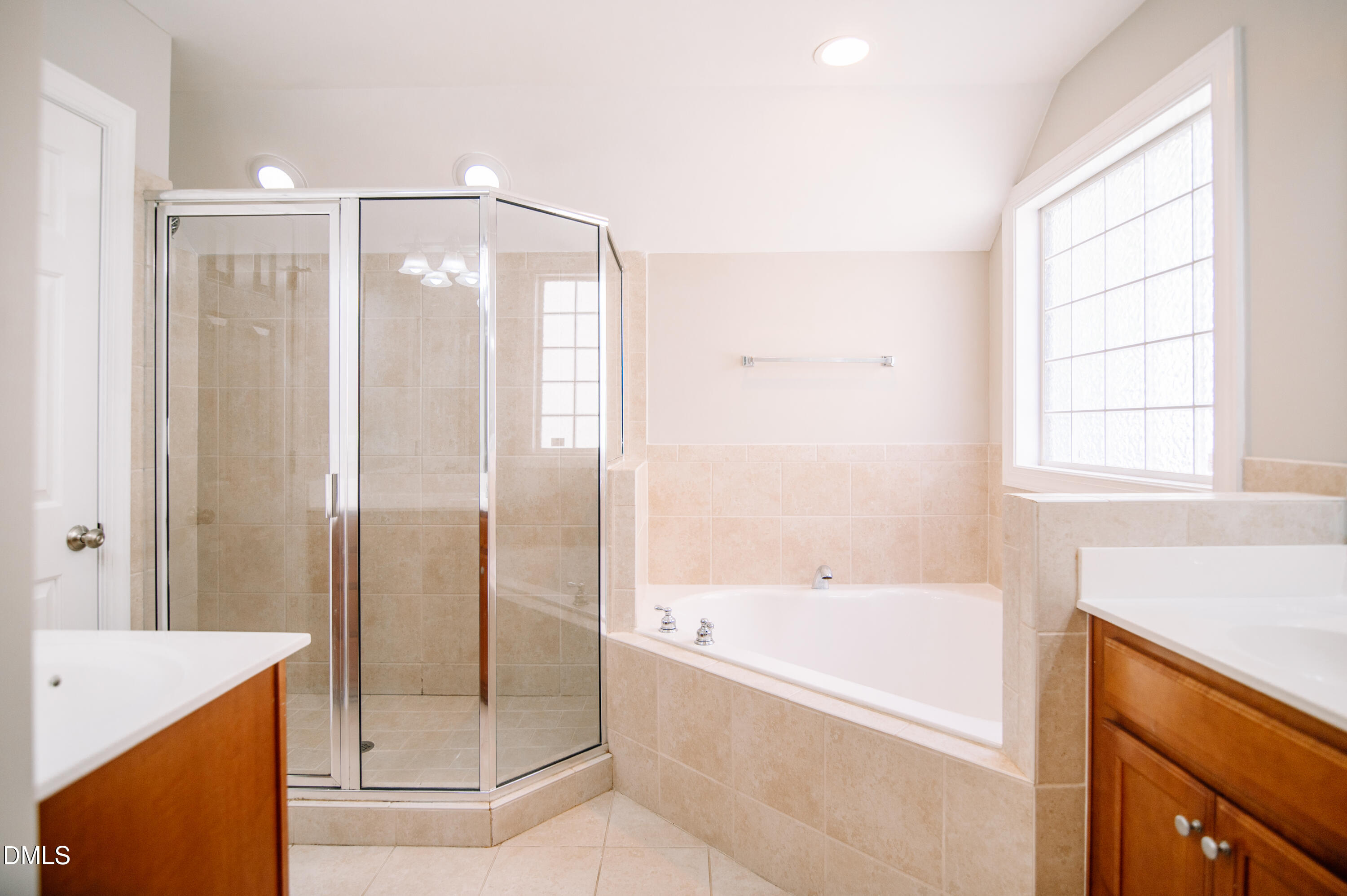 2106 Cloud Cover Lane Raleigh, NC 27614 - Photo 21 of 35 a bathroom with a bathtub and a shower