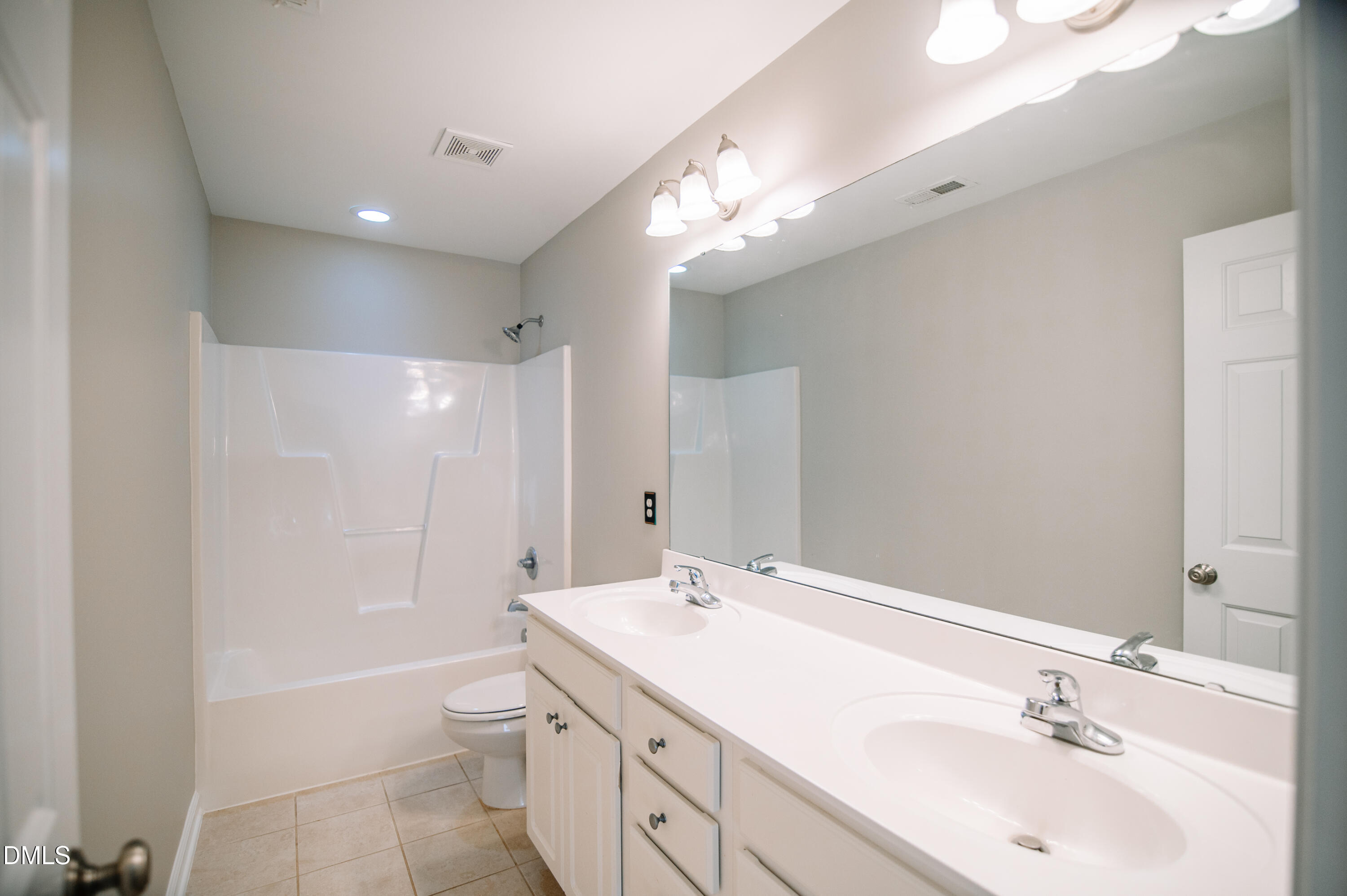 2106 Cloud Cover Lane Raleigh, NC 27614 - Photo 24 of 35 a bathroom with a double vanity sink a toilet and shower