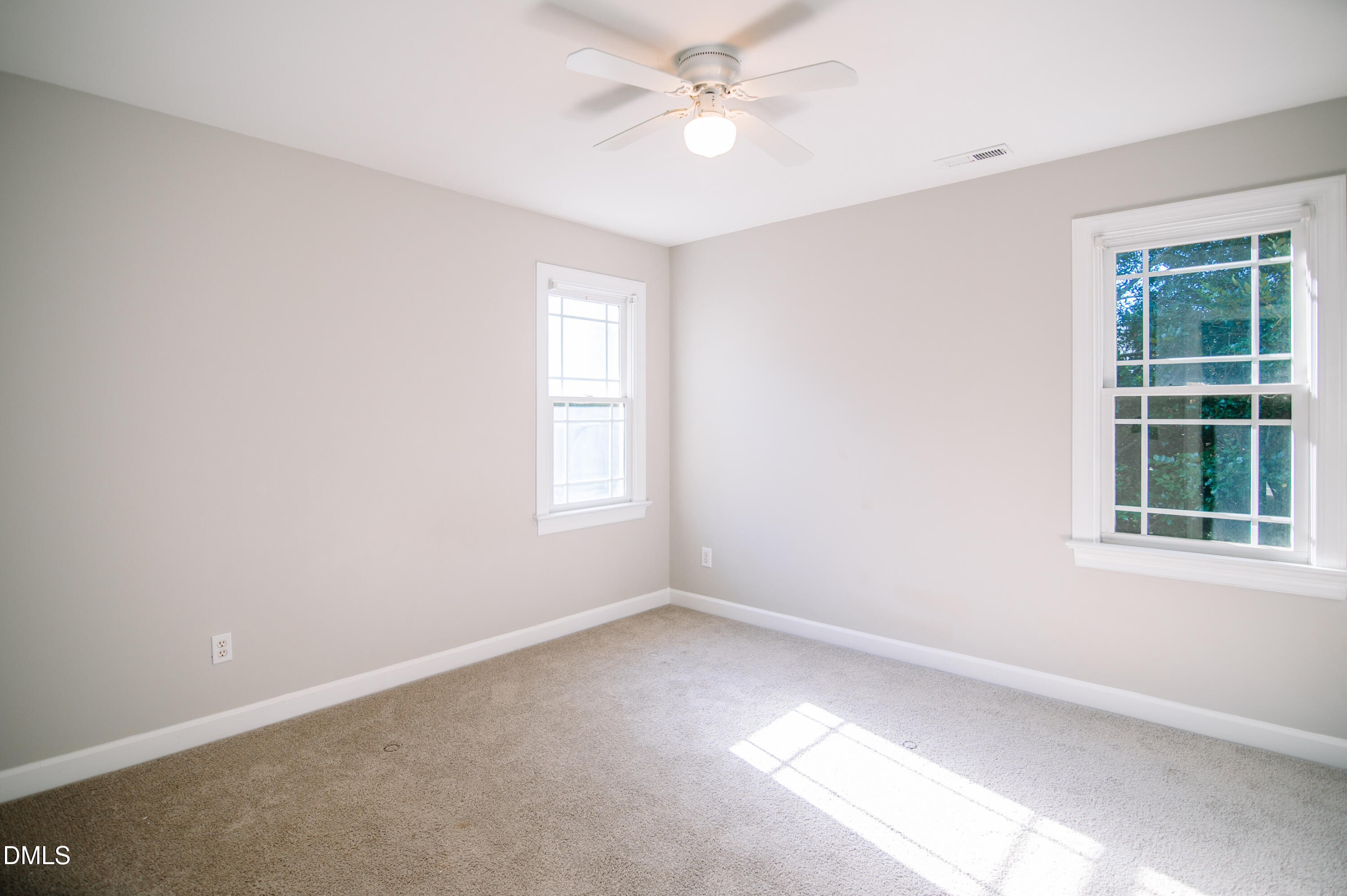 2106 Cloud Cover Lane Raleigh, NC 27614 - Photo 25 of 35 an empty room with a window and a fan