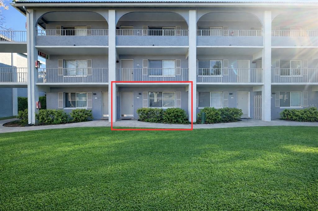 125 Water Front Way, Unit 110 Altamonte Springs, FL 32701 - Photo 14 of 17 a front view of a building with a garden