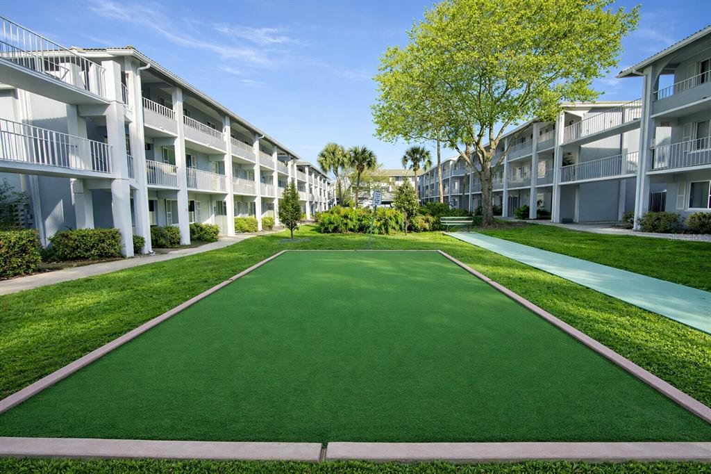125 Water Front Way, Unit 110 Altamonte Springs, FL 32701 - Photo 15 of 17 a view of a building with a big yard