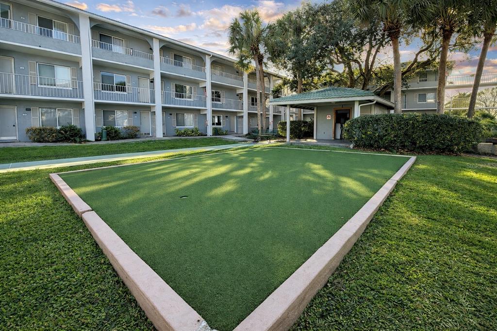 125 Water Front Way, Unit 110 Altamonte Springs, FL 32701 - Photo 16 of 17 a view of a big building with a big yard and large trees