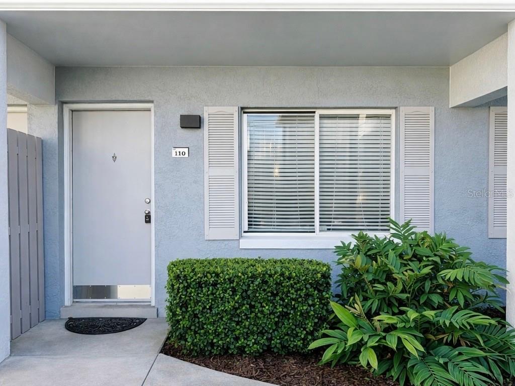 125 Water Front Way, Unit 110 Altamonte Springs, FL 32701 - Photo 2 of 17 a front view of a house with a yard