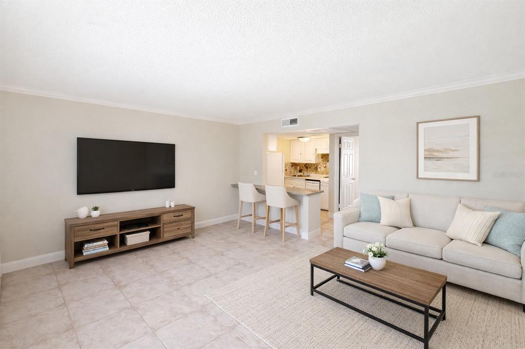 125 Water Front Way, Unit 110 Altamonte Springs, FL 32701 - Photo 5 of 17 a living room with furniture and a flat screen tv