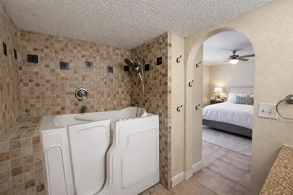 a en suite bathroom with a toilet sink and shower