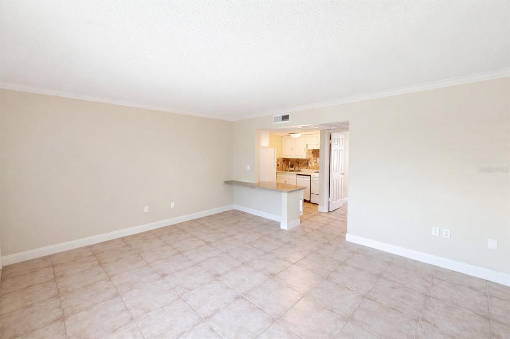 125 Water Front Way, Unit 110 Altamonte Springs, FL 32701 - Photo 10 of 17 an empty room with a kitchen