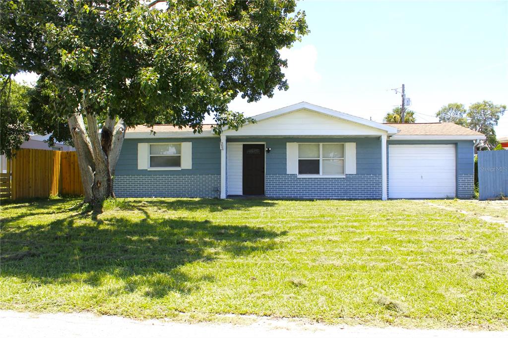4550 Abdella Lane Holiday, FL 34690 - Photo 1 of 41 a backyard of a house