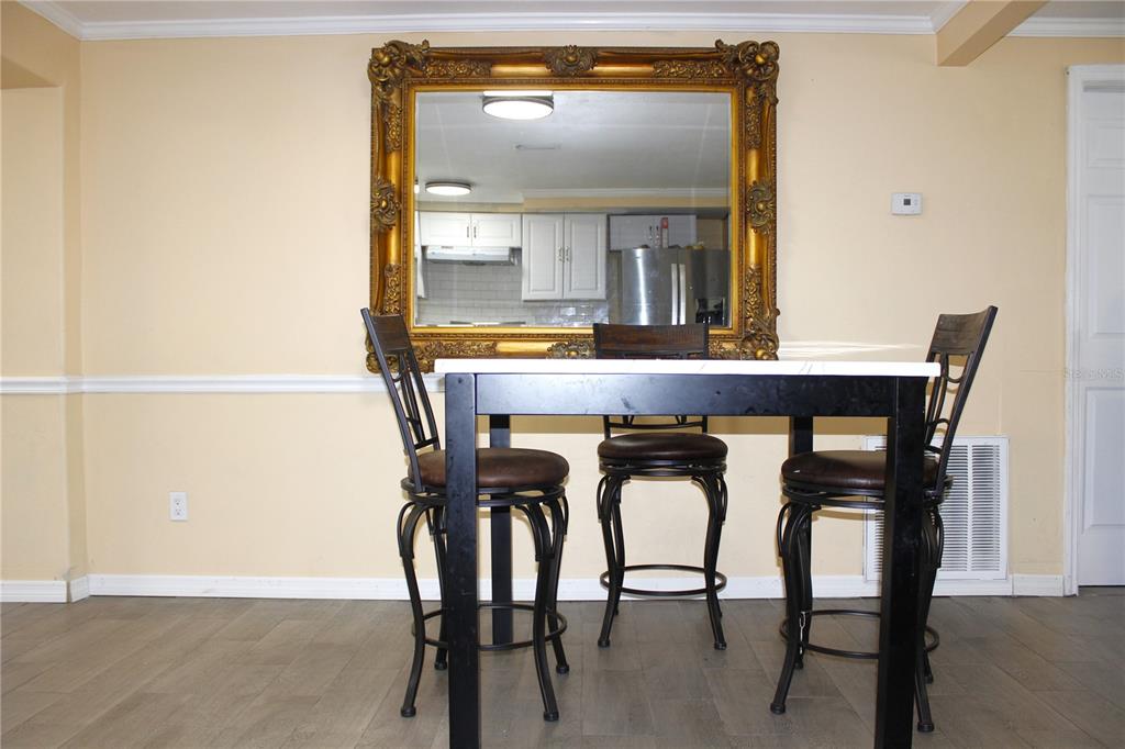 4550 Abdella Lane Holiday, FL 34690 - Photo 17 of 41 a dining room with furniture and window
