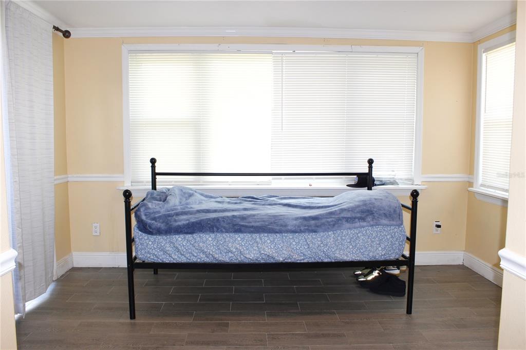 4550 Abdella Lane Holiday, FL 34690 - Photo 19 of 41 a bedroom with a bed and a window