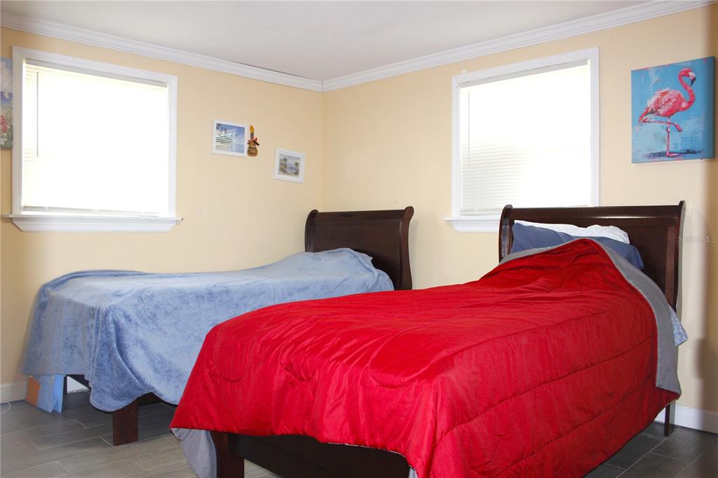 4550 Abdella Lane Holiday, FL 34690 - Photo 20 of 41 a bedroom with two beds and a window