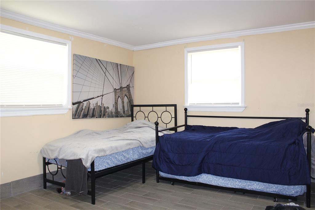 4550 Abdella Lane Holiday, FL 34690 - Photo 23 of 41 a bedroom with a bed and window