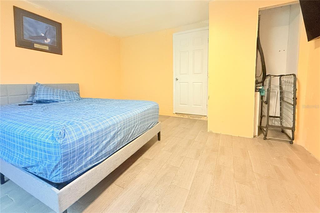 4550 Abdella Lane Holiday, FL 34690 - Photo 25 of 41 a bed sitting in a spacious bedroom next to a window