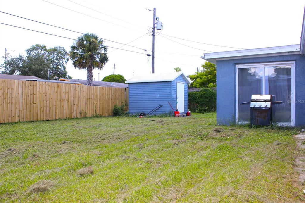 4550 Abdella Lane Holiday, FL 34690 - Photo 34 of 41 a backyard of a house