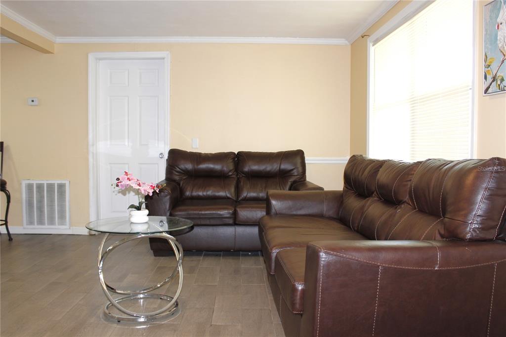 4550 Abdella Lane Holiday, FL 34690 - Photo 7 of 41 a living room with furniture and a couch