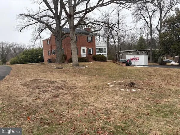 a house with trees in front of it