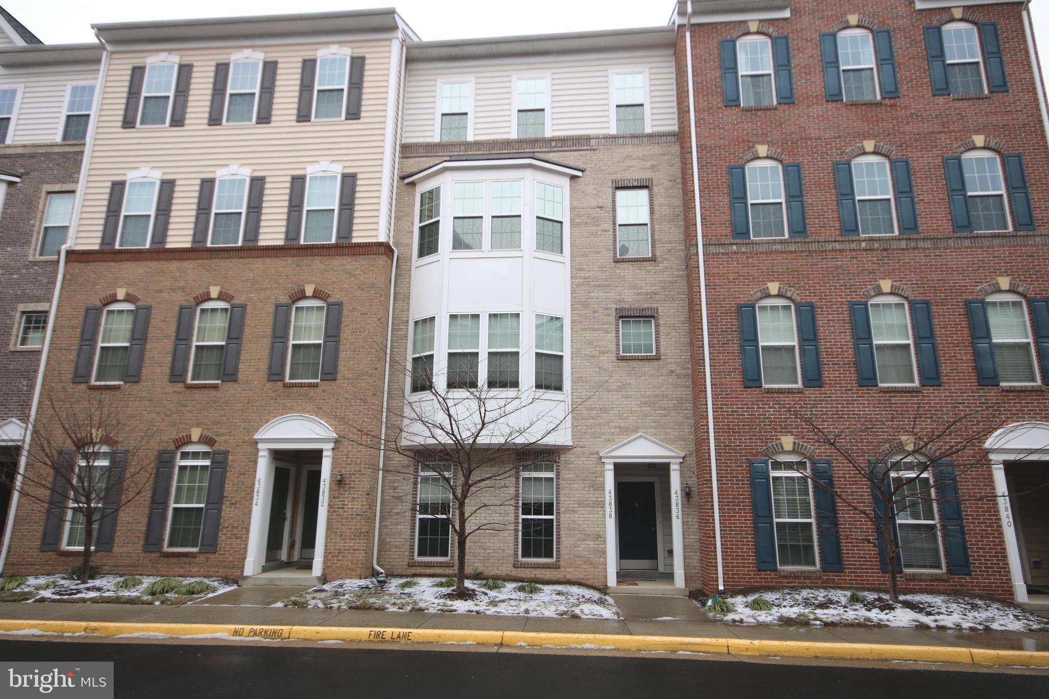 43836 Kingston Station Terrace, Unit 11201 Ashburn, VA 20148 - Photo 1 of 33 a front view of a multi story building