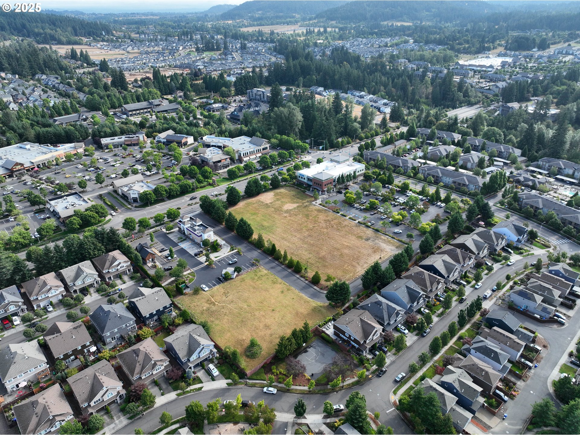 16180 Southeast Sunnyside Road Happy Valley, OR 97015 - Photo 3 of 4 an aerial view of residential houses with outdoor space