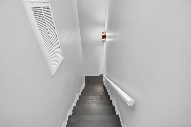 a view of a hallway with stairs