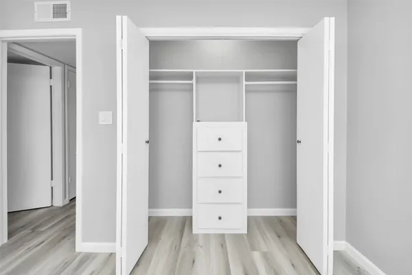 wooden floor with closet