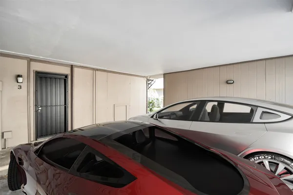 a view of a car park in front of a house