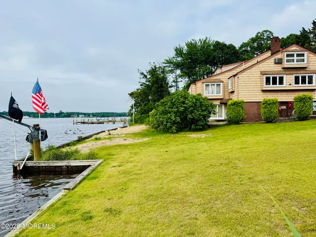 a view of swimming pool with an outdoor seating