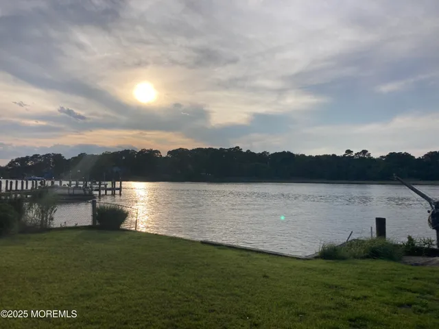 a front view of a building with retail street and entrance