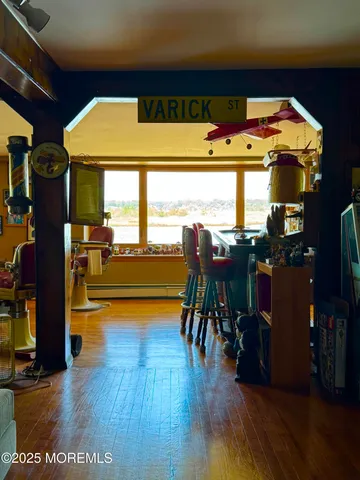 a dining room with furniture and wooden floor