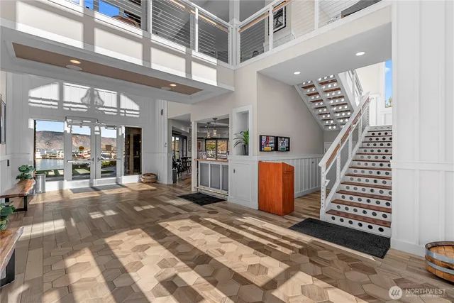 a living room with fireplace furniture and a large window