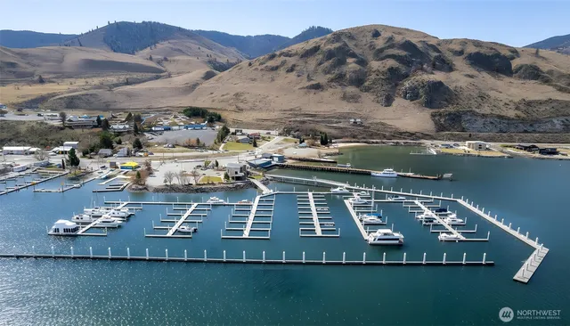 a view of a house with pool table and chairs