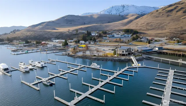 a view of a patio with chairs and a table