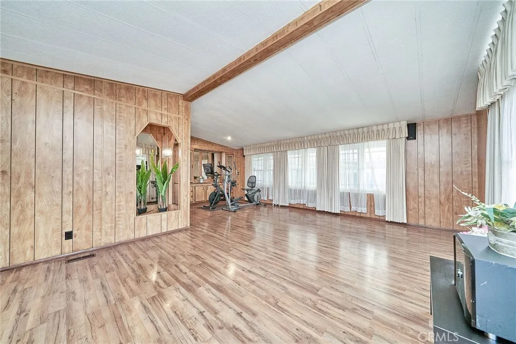 17701 Avalon, Unit 372 Carson, CA 90745 - Photo 19 of 32 a view of an empty room with wooden floor and a window