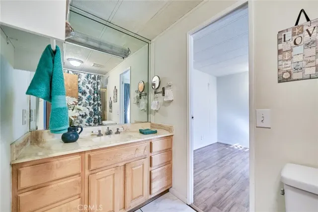 a bathroom with a double vanity sink and a mirror