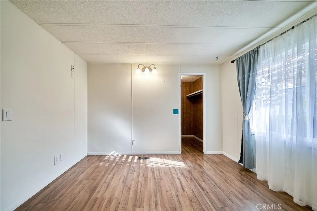 17701 Avalon, Unit 372 Carson, CA 90745 - Photo 23 of 32 a view of empty room with wooden floor and fan