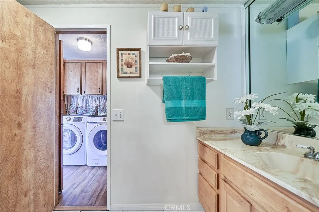 17701 Avalon, Unit 372 Carson, CA 90745 - Photo 27 of 32 a bathroom with a sink and a mirror