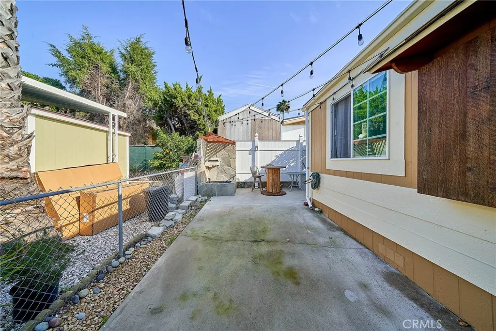 17701 Avalon, Unit 372 Carson, CA 90745 - Photo 29 of 32 a view of a porch with wooden floor and iron fence