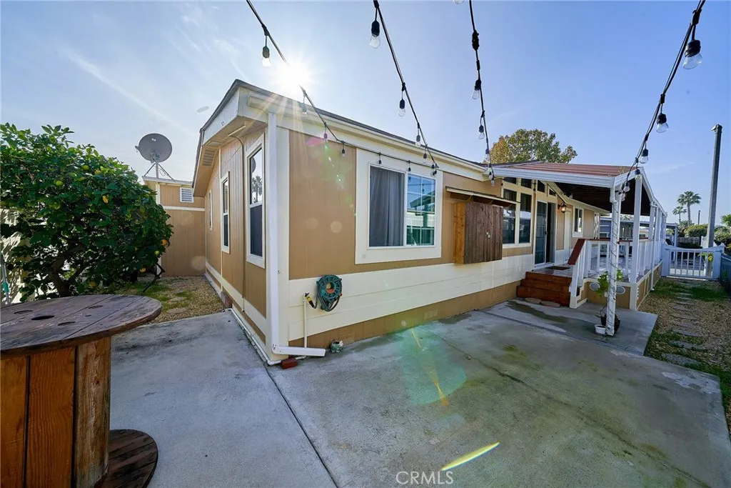 17701 Avalon, Unit 372 Carson, CA 90745 - Photo 30 of 32 a view of a house with a yard and potted plants
