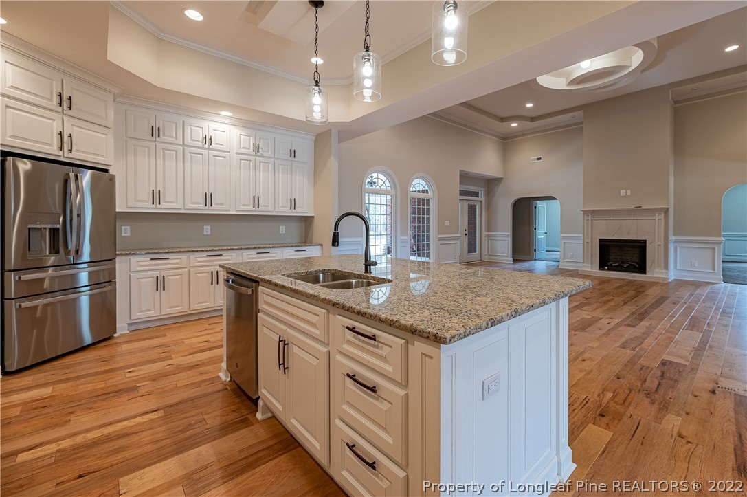 193 Kirk Road Aberdeen, NC 28315 - Photo 12 of 49 a kitchen with stainless steel appliances granite countertop a sink stove and refrigerator