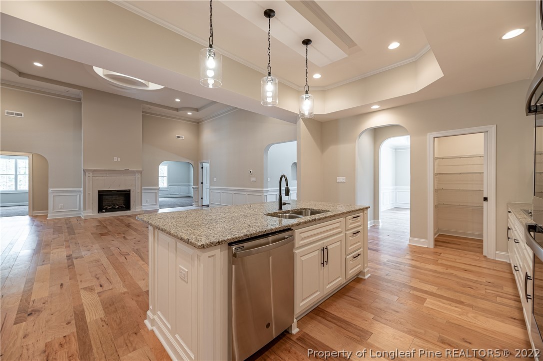 193 Kirk Road Aberdeen, NC 28315 - Photo 13 of 49 a kitchen with a stove and a wooden floor