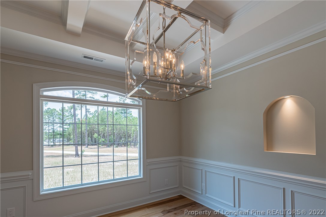 193 Kirk Road Aberdeen, NC 28315 - Photo 17 of 49 a view of a livingroom with a chandelier fan and windows