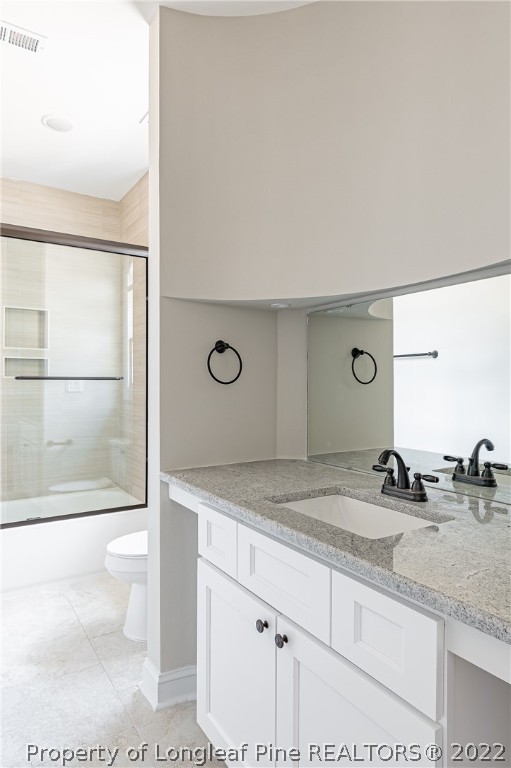 193 Kirk Road Aberdeen, NC 28315 - Photo 22 of 49 a bathroom with a granite countertop sink mirror and toilet
