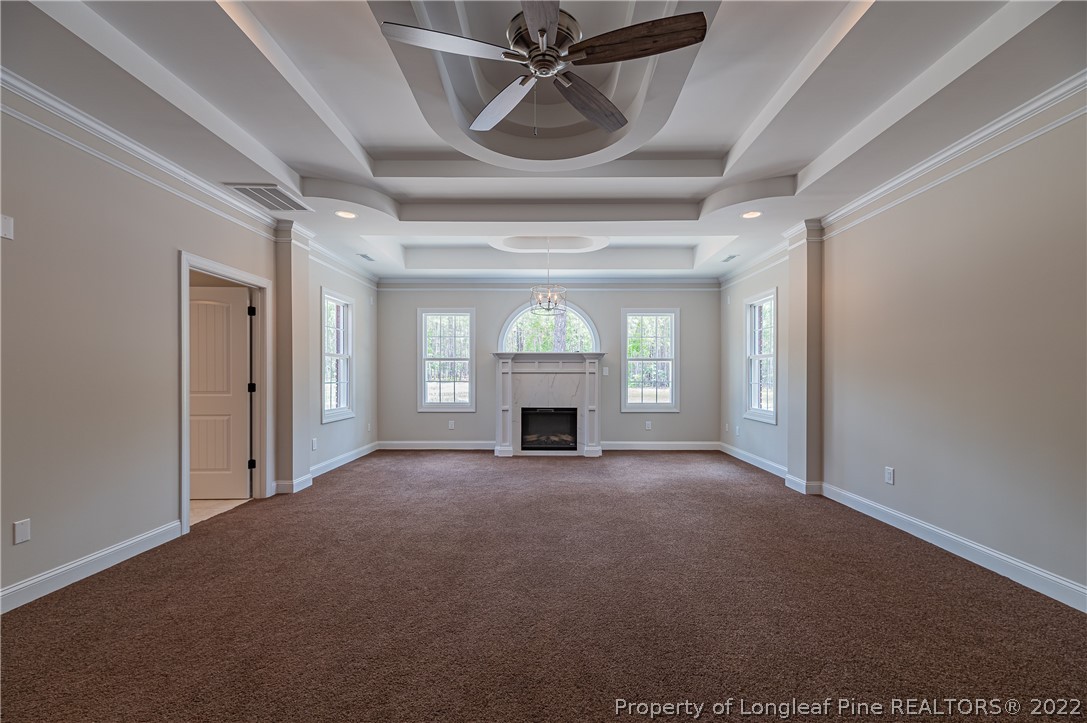 193 Kirk Road Aberdeen, NC 28315 - Photo 32 of 49 a view of an empty room with a fireplace and window