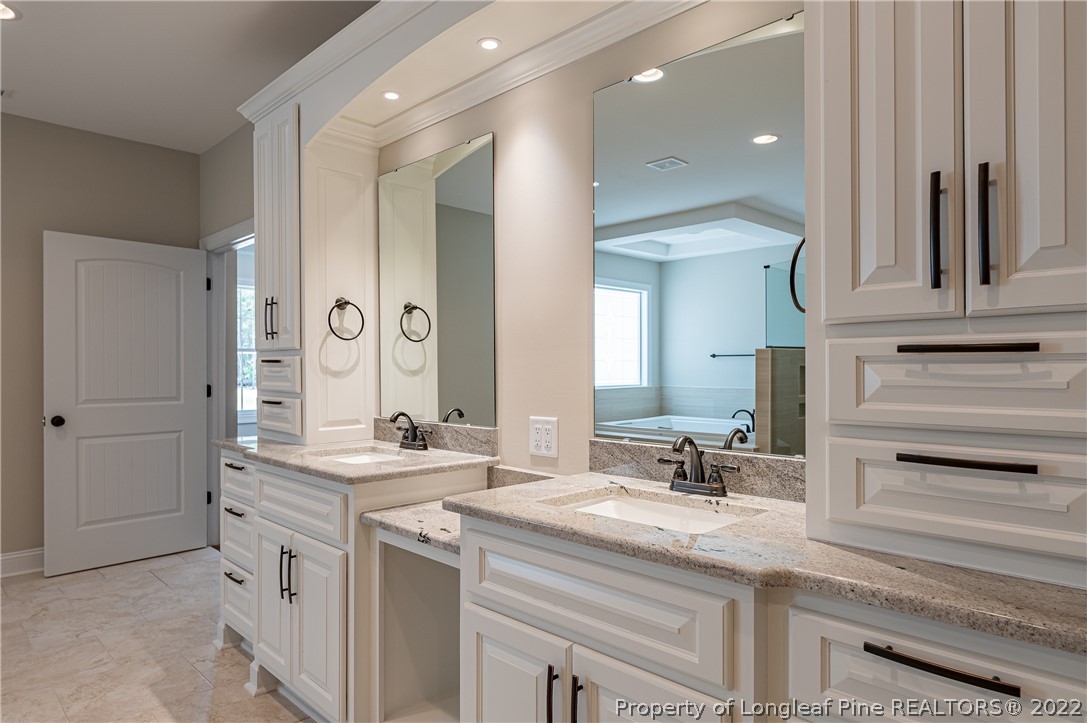 193 Kirk Road Aberdeen, NC 28315 - Photo 36 of 49 a bathroom with a sink and a mirror