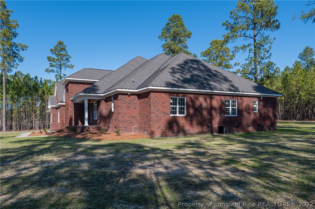 193 Kirk Road Aberdeen, NC 28315 - Photo 42 of 49 a front view of a house with a yard
